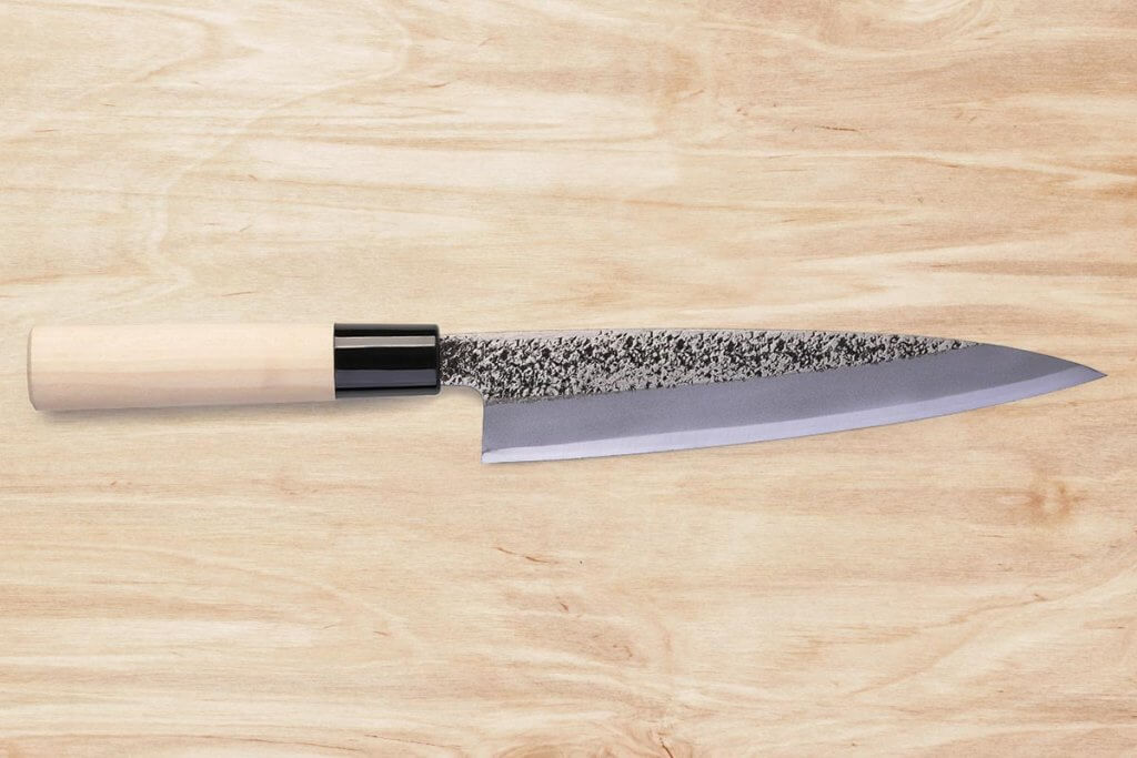 Rostfreies Stahlmesser auf Holz